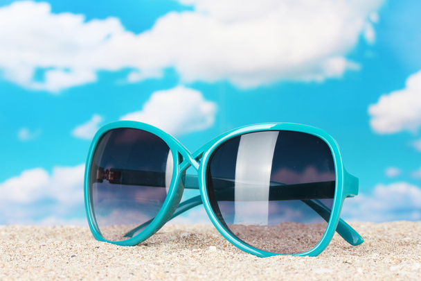 Elegant women's sunglasses at the beach - Photo, Image