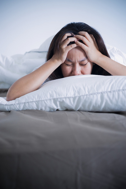Woman feeling stress on the bed. - Fotografie, Obrázek