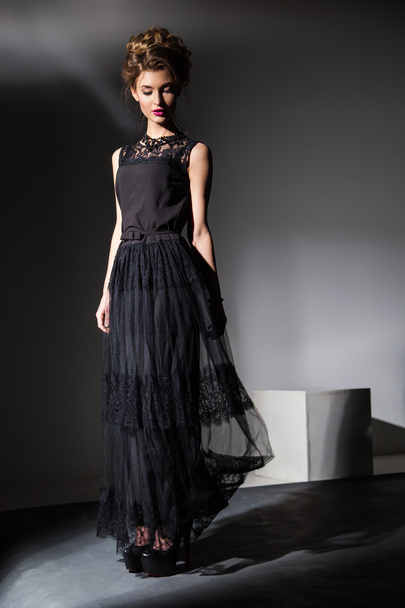 Elegant lady in black dress.Studio shot - 写真・画像