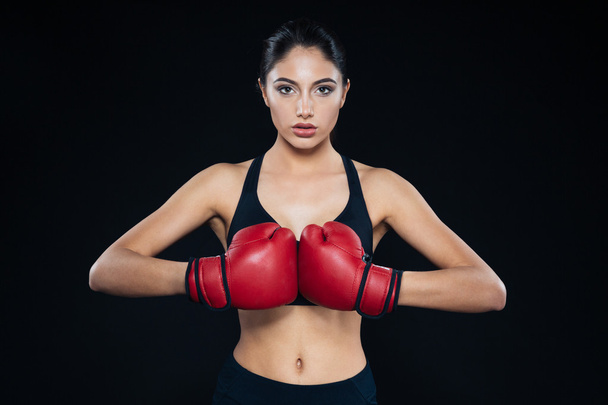 Young fitness girl with bloxing gloves looking at camera - Φωτογραφία, εικόνα