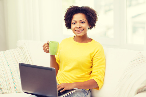 happy african american woman with laptop at home - Foto, imagen