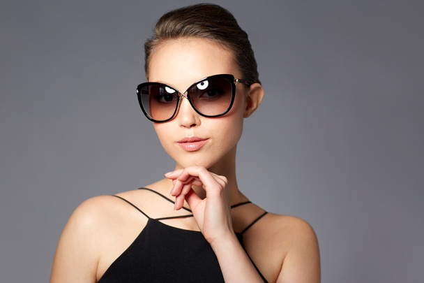 beautiful young woman in elegant black sunglasses - Фото, изображение