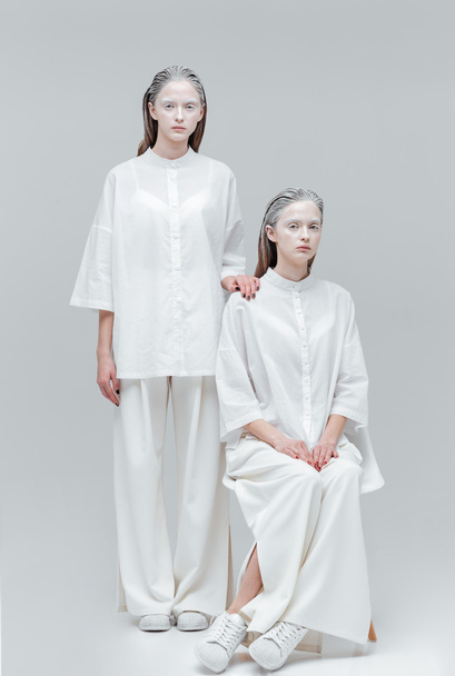 Two girls wearing white clothes - Foto, afbeelding