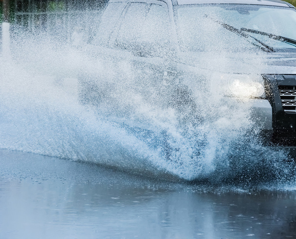 car rain puddle splashing water - Photo, image