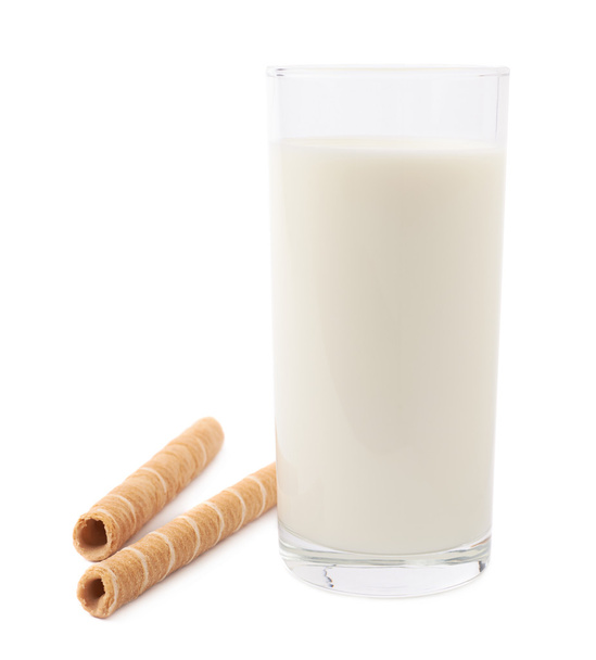 Glass of milk and wafel sticks isolated over the white background - Zdjęcie, obraz