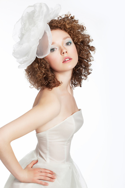 Pretty young female with curly hair and bow portrait - Fotó, kép