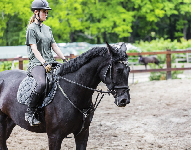 girl sportsman rides on horse  - Foto, Imagen