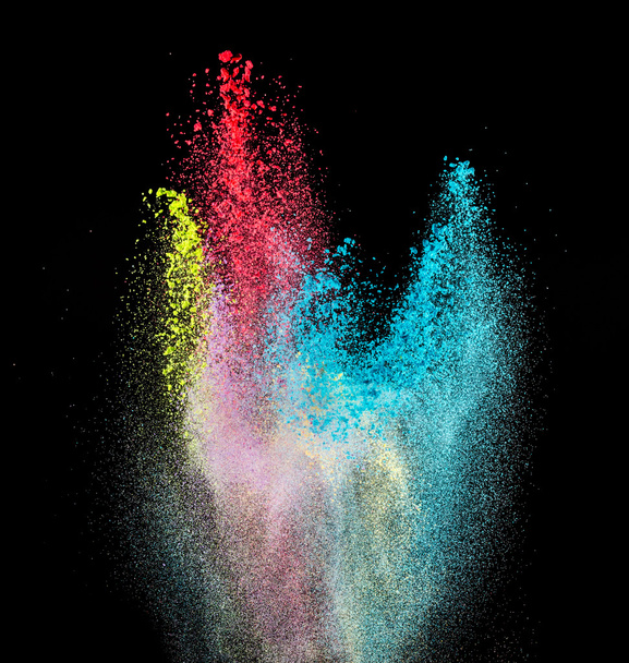 Explosion of colored powder on black background - 写真・画像