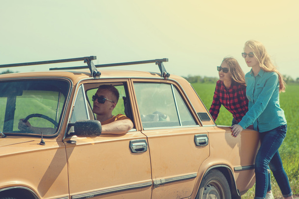 Young hipster friends on road trip on a car - Foto, immagini