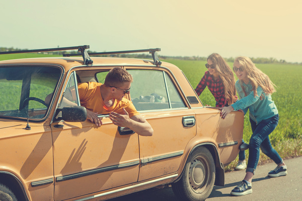 Young hipster friends on road trip on a car - Valokuva, kuva