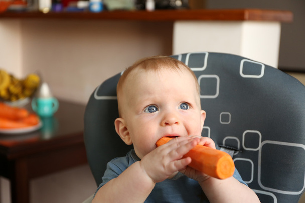Baby eating carrot   - Fotó, kép