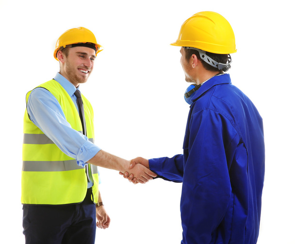 Two engineers shaking hands  isolated on white - Φωτογραφία, εικόνα