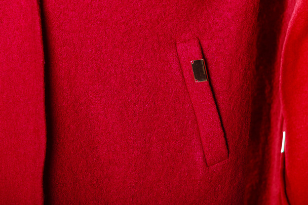 closeup red coat with pocket as background texture - Foto, afbeelding