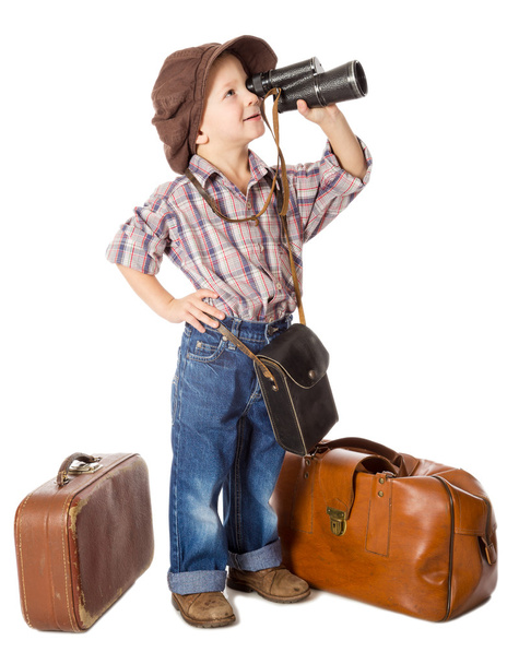 Traveling little boy with old suitcases - Фото, зображення