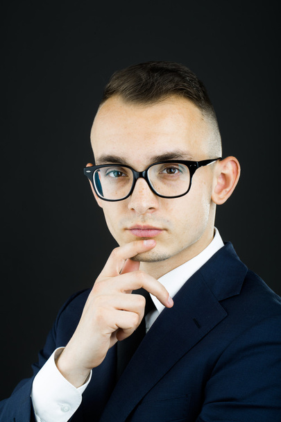 Thoughtful young guy in glasses - Valokuva, kuva