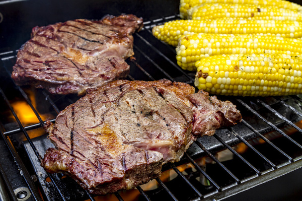Steak and Corn on Hot Grill - Photo, Image