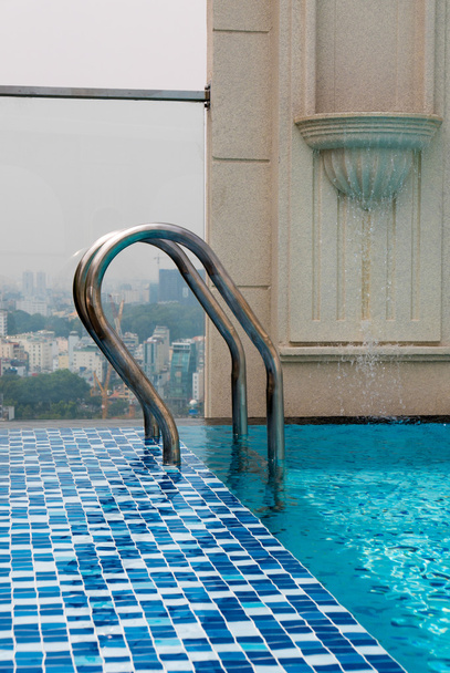 Pool on top of building with Saigon aerial view, Vietnam - Photo, Image