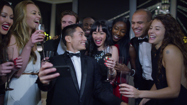 friends at a party pose to take a selfie - Filmmaterial, Video