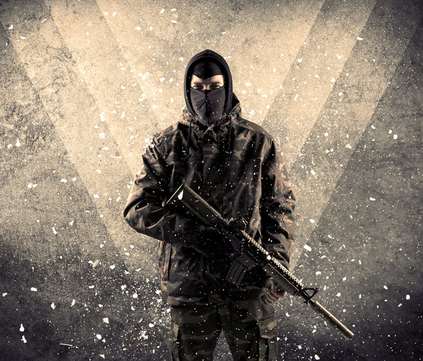 Portrait of a dangerous masked armed soldier with grungy backgro - Фото, изображение