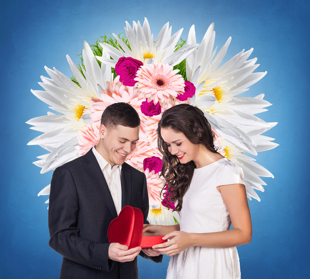 Couple with red heart shaped gift box - Foto, imagen