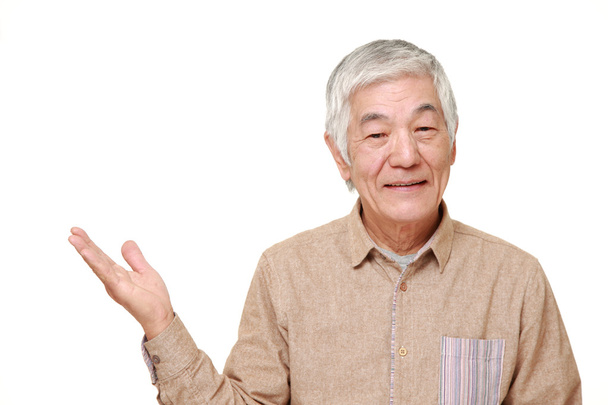 senior Japanese man presenting and showing something - Фото, зображення