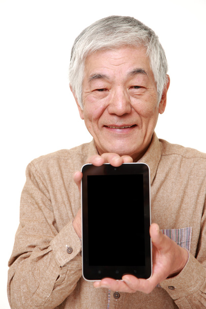 senior Japanese man holding a Tablet PC - Photo, Image