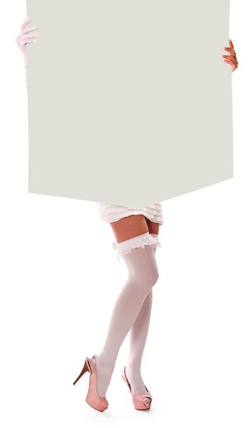 Girl holding a large sheet of paper - Φωτογραφία, εικόνα