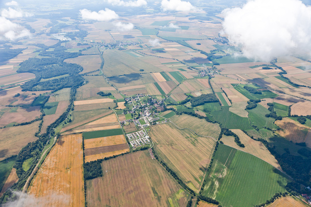 Aerial view of village landscape over clouds - Foto, afbeelding