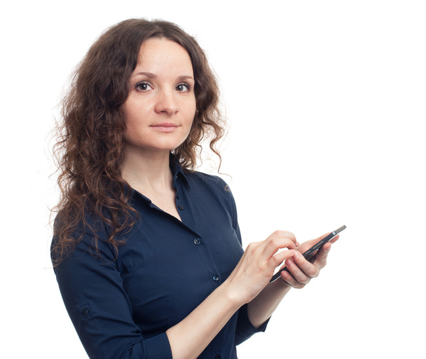 cute brunette girl with curly hair holding smartphone - Valokuva, kuva