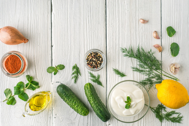 Ingredients for tzatziki on the white wooden table  top view - 写真・画像