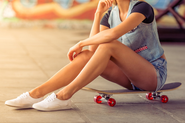 Beautiful skateboarding girl - Фото, изображение