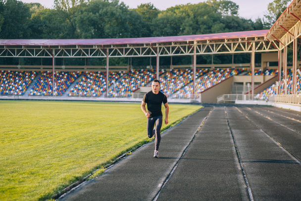 Runner on the track at a sport stadium - 写真・画像