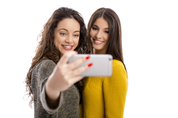 Girls taking selfie on smartphone   - Photo, image
