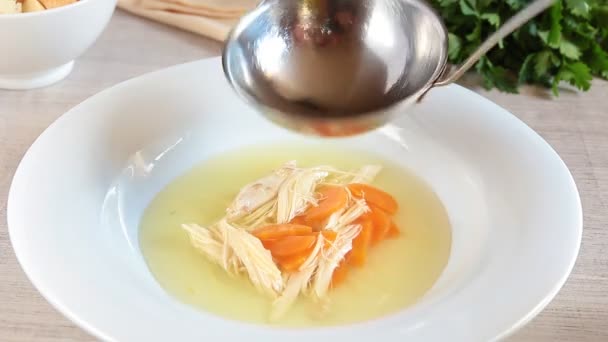 soup ladle pour chicken soup in the plate - Footage, Video