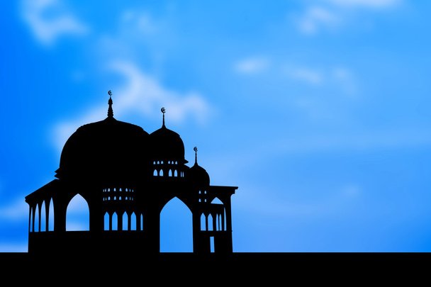 青の背景にモスクのシルエット - 写真・画像