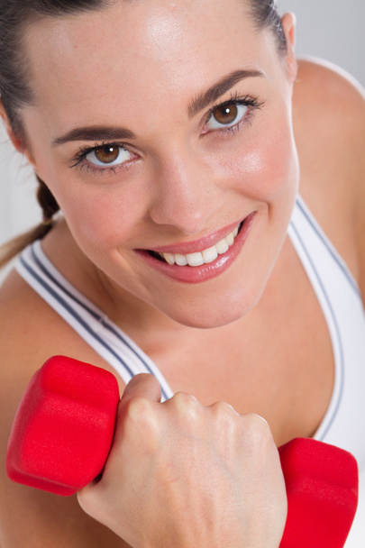 Fitness woman exercising with dumbbell - Fotó, kép