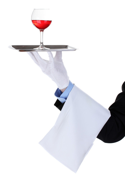 formele ober met een glas wijn op zilveren dienblad geïsoleerd op wit - Foto, afbeelding