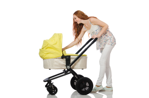 Жінка з дитиною і коляскою ізольовані на білому
 - Фото, зображення