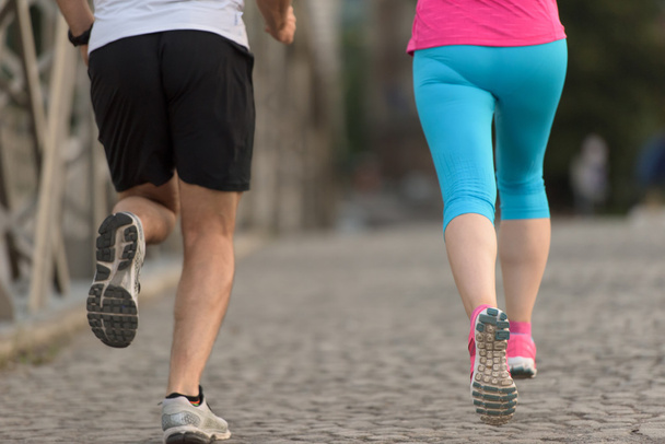 healthy mature couple jogging - 写真・画像