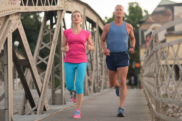 healthy mature couple jogging - Photo, Image