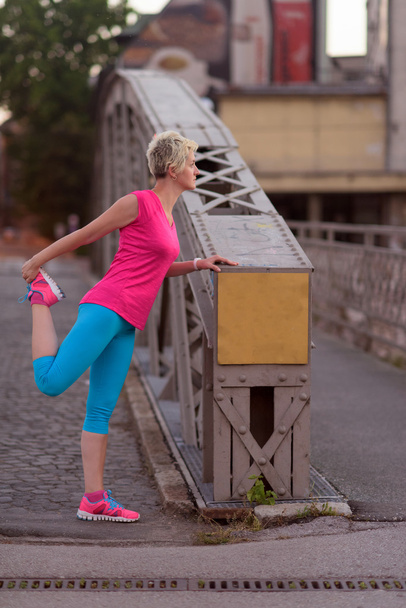 blonde woman  stretching before morning jogging - Foto, Imagem