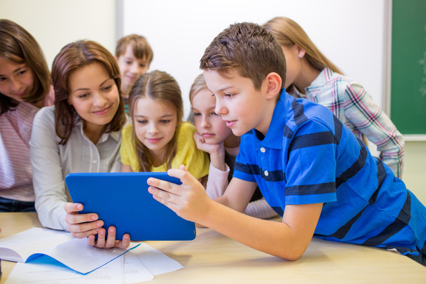 group of kids with teacher and tablet pc at school - Zdjęcie, obraz
