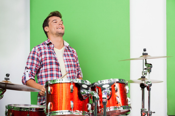 Male Professional Playing Drums In Recording Studio - Фото, изображение
