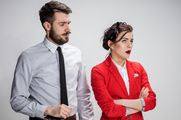 The business man and woman communicating on a gray background - Photo, image