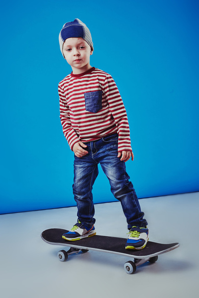 Happy boy riding skateboard - Photo, image