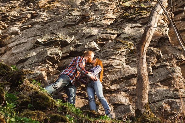 Young couple near the rock - Фото, зображення