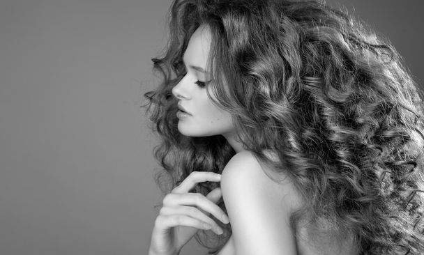 Beautiful Woman with Curly Long Hair. High quality image. - Foto, immagini