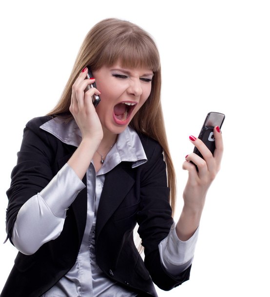 Stressed business woman with two cell phones - Foto, imagen
