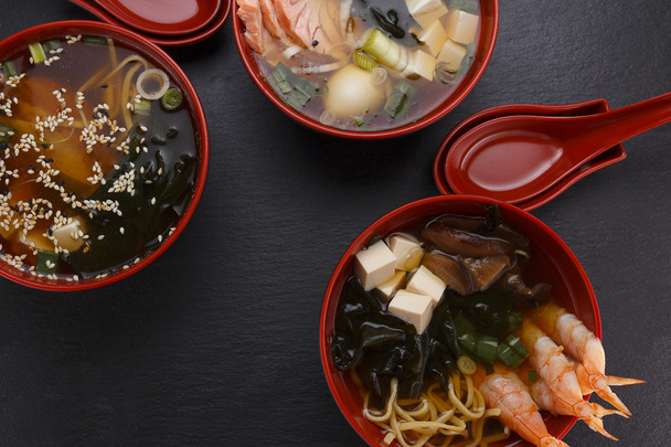 Japanese cuisine. Soup over black background. - Fotoğraf, Görsel