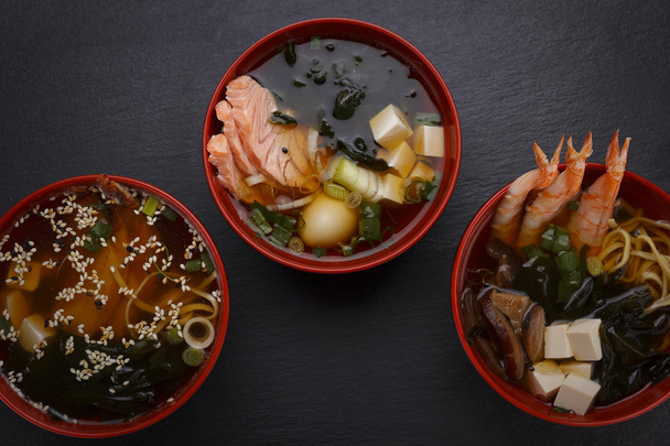 Japanese cuisine. Soup over black background. - Foto, afbeelding